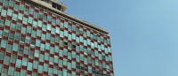 a tall building with red and blue windows